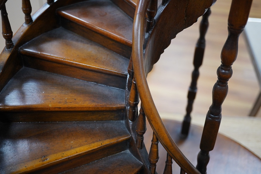 A scale model hardwood spiral staircase, 106cm tall. Condition - good